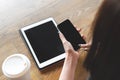 Young woman holding smartphone with blank screen and tablet pc o Royalty Free Stock Photo