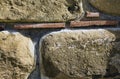 Close-up view of handcrafted stone wall. Close-up view of original brickwork. Typical architecture of Rome empire