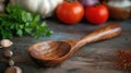 Close-up view of a handheld wooden kitchen utensil, emphasizing the grain of sustainably sourced wood, with fresh