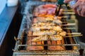 A Man Is Cooking Fresh Tuna Sticks On A Grill Royalty Free Stock Photo