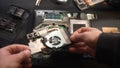 Hands Disassembling Laptop for Repair Process Royalty Free Stock Photo