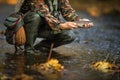 Handsome fly fisherman fly fishing on a splendid mountain river for rainbow trout