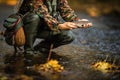 Close-up view of the hands of a fly fisherman holding a lovely trout Royalty Free Stock Photo