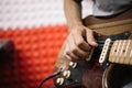 Close-up view of hands of male musician playing guitar Royalty Free Stock Photo