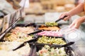 Close up view of hands picking prepared meals Royalty Free Stock Photo