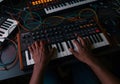 Hands playing synthesizer electronic music instruments Royalty Free Stock Photo