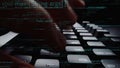 Close-up View of Hands Typing on a Dark Keyboard Surrounded by Code, Representing Programming, Coding, and Technology in Royalty Free Stock Photo