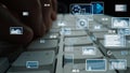 Close-Up View of Hands Typing on Keyboard Surrounded by Digital Data Visualization Elements and Analytics Graphs in Royalty Free Stock Photo