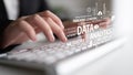 Hands typing on a keyboard with data analytics and technology concepts in the background for modern business and digital Royalty Free Stock Photo