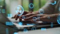 Close-Up View of Hands Typing on Laptop with Futuristic Data Visualization and Graphical User Interface Elements in Royalty Free Stock Photo
