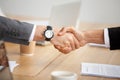 Closeup view of handshake, two businessmen in suits shaking hand Royalty Free Stock Photo