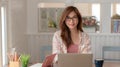 Close up view of happy college girl sitting in her comfortable working space Royalty Free Stock Photo