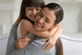 Mother cuddle daughter feeling love and connection closeup view Royalty Free Stock Photo