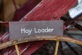 Close-up view of hay loader with a signboard