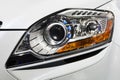 Close up view of headlight white car Royalty Free Stock Photo