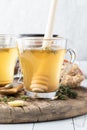 Close up view of a healing medicinal tea with thyme and ginger. Royalty Free Stock Photo