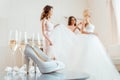 High heels and champagne with bride with bridesmaids Royalty Free Stock Photo