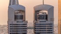 Close up view of the high-rise buildings on Sheikh Zayed Road in Dubai aerial timelapse, UAE.
