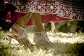 Close up view of Hindu bride's painted feet dancing in garden