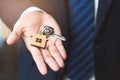 Close up view home keys in the agent hand giving to new owner Royalty Free Stock Photo