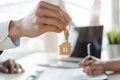 Close up view home keys in the agent hand giving to new owner Royalty Free Stock Photo