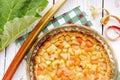 Close up view of homemade round baked rhubarb  Rheum hybridum  pie white rustic wood table background. Royalty Free Stock Photo