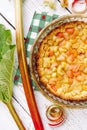 Close up view of homemade round baked rhubarb  Rheum hybridum  pie white rustic wood table background. Royalty Free Stock Photo