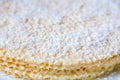 Close up view of homemade waffle cake with condensed milk and coconut flakes Royalty Free Stock Photo