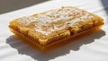 A close-up view of a honeycomb piece placed on a white surface Royalty Free Stock Photo