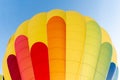 Close-up view of a hot air balloon in green, blue, red and yellow colors