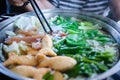 Close up view of hot pot with meat beef sliced and vegetables. Shabu Shabu is style beef in hot pot dish of thinly sliced meat and Royalty Free Stock Photo