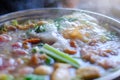 Close up view of hot pot with meat beef sliced and vegetables. Shabu Shabu is style beef in hot pot dish of thinly sliced meat Royalty Free Stock Photo