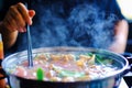 Close up view of hotpot with meat beef sliced and vegetables. Shabu Shabu is style beef in hotpot dish of thinly sliced meat Royalty Free Stock Photo