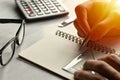 Close-up view human hand, Creative writing for free time with silver pencil, ruler, glasses and calculator is elements.