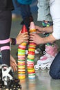 Close up view of human hands building plastic color cones on rollerskating playground Royalty Free Stock Photo