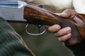 Close up view of a hunter man aiming with a gun to his prey. Royalty Free Stock Photo