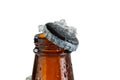 Close up view of an ice cold beer bottle neck and removed cap Royalty Free Stock Photo