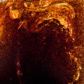Close up view of the ice cubes in dark cola background