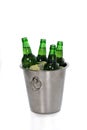 Close-up view of ice cubes, lemon slices and green beer bottles in bucket Royalty Free Stock Photo