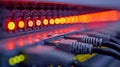 Fiber Optic Cables Connected to a Switch with Glowing Lights in the Data Center Royalty Free Stock Photo