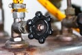 Close-up view of industrial black valve with yellow hose from the garment industry iron steam with blurry and soft focus Royalty Free Stock Photo