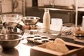 close up view of ingredients for dough and kitchen utensils on counter in restaurant Royalty Free Stock Photo