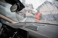 View from inside car on silhouette of man who washing automobile. Royalty Free Stock Photo