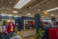 Close up view of interior with clothing Tommy Hilfiger section of department store Macy`s. New York. Royalty Free Stock Photo