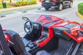 Close-up view of the interior of a red Polaris Slingshot car.