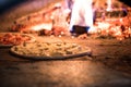 close up view of italian pizza baking in brick oven Royalty Free Stock Photo
