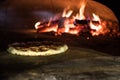 close up view of italian pizza baking in brick oven Royalty Free Stock Photo