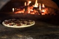 close up view of italian pizza baking in brick oven Royalty Free Stock Photo