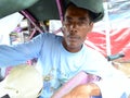 Close up view of a Javanese man who works as a pedicab driver