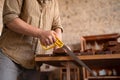 Close-up view of a joiner sawing wood Royalty Free Stock Photo